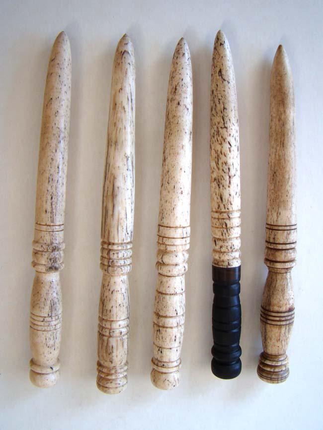 A late 19th century whalebone stand holding five fids. — image 2